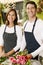 Portrait Of Two Sales Assistants In Florists Shop