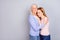 Portrait of two satisfied people cuddle closed eyes enjoy moment isolated on grey color background