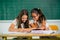 Portrait of two schoolgirls in a classroom.