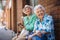 Portrait of two senior female friends in the city, eating ice cream on a hot summer day.