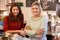 Portrait Of Two Women Running Coffee Shop Together