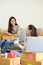 Portrait, Two young Asian female online shop owners preparing shipping packages together