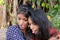 Portrait of two young Indian females taking a selfie with funny facial expression