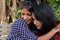 Portrait of two young Indian females taking a selfie hugging each other