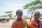 Portrait of two young maasai girls with traditional jewelery and clothing