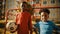 Portrait of Two Young Talented African Boys Standing Together while Looking at Camera and Smiling