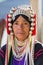 Portrait of an unidentified Akha woman with traditional clothes and silver jewelery in Akha hilltribe village