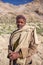 Portrait of unidentified indian shepherd with his sheeps near Sarchu camp in Ladakh, Northern India