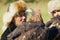 Portrait of unidentified Kazakh hunters holding golden eagles Aquila chrysaetos, circa Almaty, Kazakhstan.