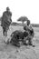 Portrait of unidentified young Maasai warriors shows how to make fire