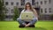 Portrait of university female student studying, using laptop computer