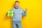 Portrait of unsatisfied disappointed man look direct finger empty space isolated on yellow color background