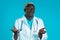 Portrait of unsure african doctor in professional medical white coat shrugs his arms, makes gesture of I don`t know