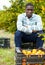 Portrait of upset Afro man on farm