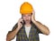 Portrait of upset construction worker or stressed contractor man in builder hat talking on mobile phone unhappy in stress messing