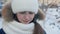 Portrait upset young girl crying on winter street. Close up face unhappy girl crying on winter walk at snowy city street