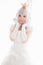 Portrait of vampire dracula young woman dress in white tone room halloween concept