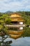 Portrait vertical view of famous Golden Pavilion Kinkaku-ji - a Buddhist temple in Kyoto, Japan