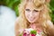 Portrait of a very beautiful bride blonde in a white dress with