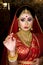 Portrait of very beautiful surprised Indian bride closeup. Concept of human emotions