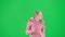 Portrait of victim on chroma key green screen background. Young girl running, scared expression, looking around, running