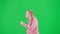Portrait of victim on chroma key green screen background. Young girl running, scared expression, looking around, running