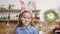 Portrait video of cute playful girl dressed as easter bunny.
