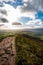 Portrait view of Skirrid Fawr downlards path in the Welsh countryside.