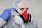 Portrait of a virologist in a protective suit
