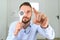 Portrait, vision and spoon with a man patient at the optometrist for an eye exam testing his depth perception