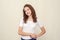 Portrait of waist-high girl with brown curly hair in white