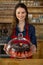 Portrait of waitress serving cake at counter in cafÃ©