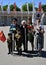 Portrait of war veteran surrounded by several generations of people