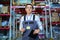 Portrait of a warehouse worker with a clipboard in his hands.