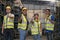 Portrait of warehouse worker. Group of factory industry worker in industrial plants. Team of workers and engineer showing thumb up