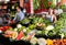 Portrait of welcoming female shop assistant and working male seller in vegetable shop