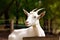 Portrait of a white goat with horns on a background of green trees. Generative AI.