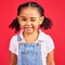 Portrait, wink and a black child on a red background in studio having fun or feeling carefree. Kids, fashion and smile