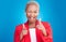 Portrait, wink and finger guns with a black woman on a pink background in studio for choice or fun. Face, smile or