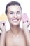 Portrait of Winsome Young Girl with Fresh Clean Skin for Health Facial Therapy Posing With Two Cleaning Sponges Against Pure White