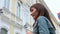 Portrait of a woman against the backdrop of buildings