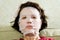 Portrait woman applying rejuvenating facial mask on her face