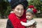 Portrait woman Asia with baby, ethnic group Yao