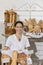 Portrait of woman in bakery with fresh breads