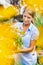 Portrait of woman buyer looking at flower on pot in shop