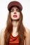 Portrait of a woman in a cap Glamor look ahead model red sundress