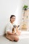 Portrait of woman with Corgi dog at home, indoor.  Lifestyle concept