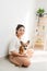 Portrait of woman with Corgi dog at home, indoor.  Lifestyle concept