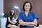 Portrait of woman cosmetologist doctor with crossed arms at beauty clinic