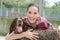 Portrait woman cuddling Pointer dog